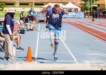 Fort Ft. Lauderdale Florida,Ansin Sports Complex Track & Field National Senior Games,man male long jump competition competitor jumping Stock Photo