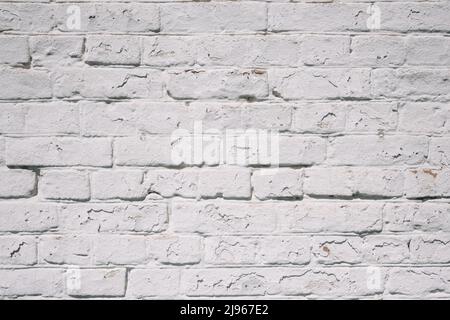 Grunge white brick wall background with aging texture closeup Stock Photo