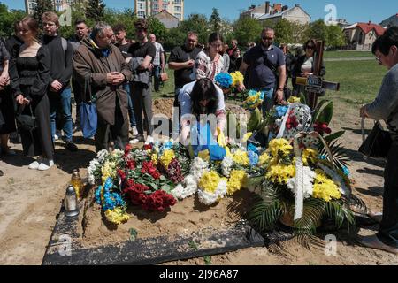 Women wearing traditional Ukrainian Vyshyvankas (embroidered shirts) seen at the grave of a Ukrainian soldier, Private Bogdan Volodymyrovych who was killed by Russian forces near Dryzba in Luhansk region at Lychakiv Cemetery. Stock Photo