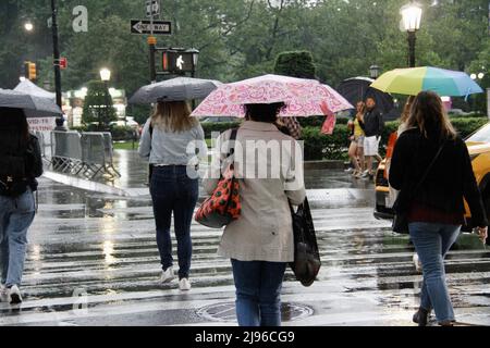 New York, USA. 20th May, 2022. (NEW) A surprised Heavy Rainfall Caught New Yorkers unaware. May 20, 2022, New York, USA: A sudden change of weather bringing a heavy rainfall caught New Yorkers and tourists unaware in Manhattan in the early evening of Friday (20). People had to improvise using their jackets, shirts and anything available to protect themselves from the rainfall apart from umbrellas and ponchos. The rainfall also affected the flow of vehicles traffic. The weather is about 66Ã‚Â°F (18.8Ã‚Â°C) (Credit Image: © Niyi Fote/TheNEWS2 via ZUMA Press Wire) Credit: ZUMA Press, Inc./Alamy L Stock Photo