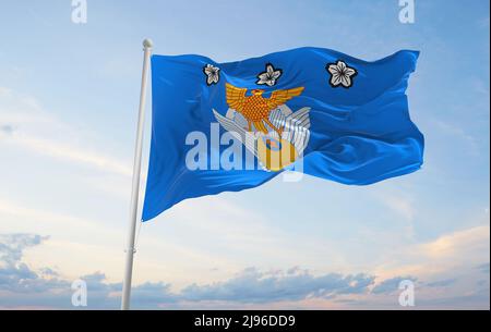 official flag of Air Defense Command of Air Self Defense Force, Japan at cloudy sky background on sunset, panoramic view. Japanese patriot concept. co Stock Photo