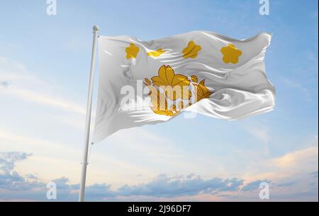 official flag of Chief of Staff of Ground Self Defense Force Japan at cloudy sky background on sunset, panoramic view. Japanese travel and patriot con Stock Photo