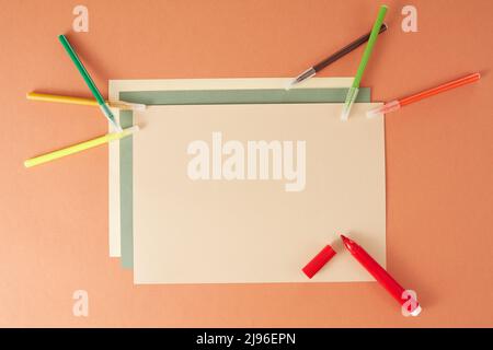 Colorful back to school flat lay and clipboard on brown background Stock Photo