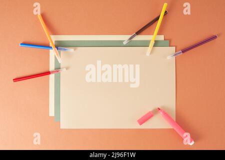 Colorful back to school flat lay and clipboard on brown background Stock Photo