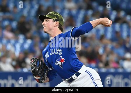 Toronto, Canada. 20th May, 2022. Toronto Blue Jays' George Springer hits an  RBI single, scoring Bradley Zimmer, not shown, in the fifth inning of an  Interleague League baseball game against the Cincinnati