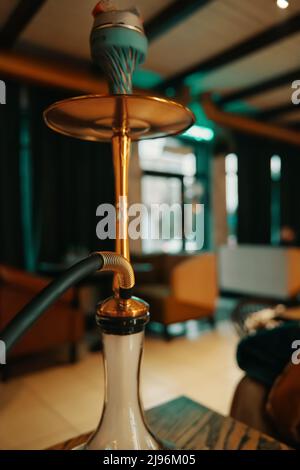 Hookah on table in lounge cafe. Stock Photo