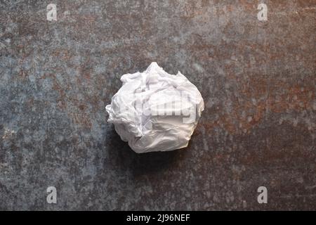White color crumpled parchment paper ball Stock Photo