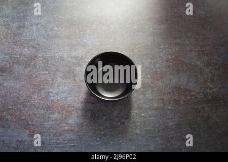 Black color empty round ceramic bowl Stock Photo