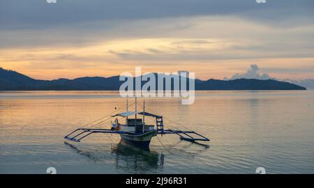 Port Barton, Philippines - May 2022: A fishing boat on the beach at Port Barton on May 15, 2022 in Palawan, Philippines. Stock Photo