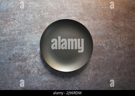Black color empty ceramic side plate Stock Photo