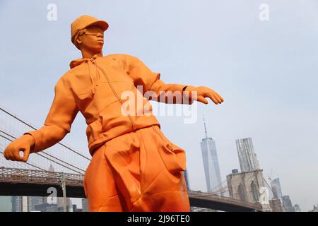 New York, USA. 20th May, 2022. Giant orange skateborder display in Dumbo, Brooklyn to celebrate the exhibition showcase of all 47 Louis Vuitton x Nike Air Force 1 styles created by Virgil Abloh in New York City, NY, USA on May 20, 2022. Photo by Charles Guerin/ABACAPRESS.COM Credit: Abaca Press/Alamy Live News Stock Photo