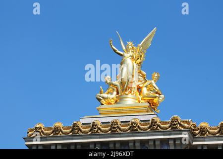 Charles Gumery's gilded sculpture L'Harmonie (Harmony) glistens in the sunlight atop the Palais Garnier (Paris Opera House) in Paris, France. Stock Photo