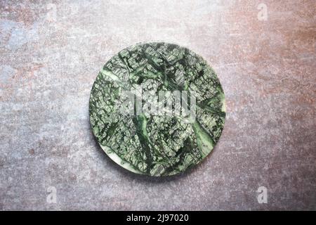 Green marble round rolling board Stock Photo
