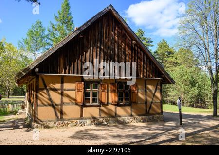 Wdzydze Kiszewskie, Poland - May 15, 2022: Wooden cottage in Kashubian Ethnographic Park in Wdzydze Kiszewskie Stock Photo