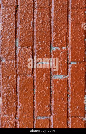 background in the form of brickwork with painted red paint. High quality photo Stock Photo