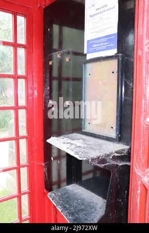 Interior view of a disused Red English Telephone booth Stock Photo