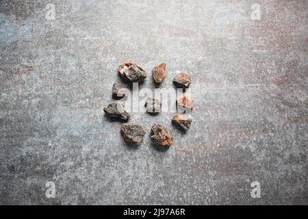 Raw whole dried black rock salt Stock Photo