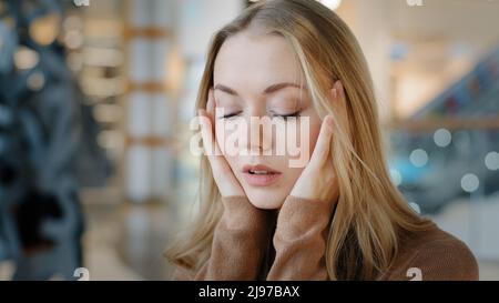 Portrait caucasian frightened stressed worried woman feeling stress worry girl suffer unwell fever headache panic attack problems breaking up breakdow Stock Photo