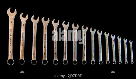 Old set of open-end wrenches isolated on black. Stock Photo