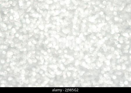 Abstract white bokeh background, defocused blurry sparkles. Stock Photo