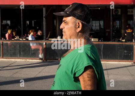 Los Angeles, USA. 12 May, 2022.A man walking on Venice beach before sunset. Stock Photo