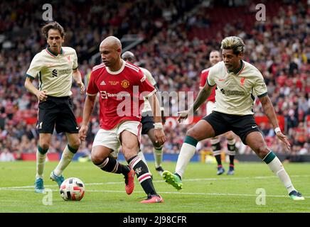 Manchester United Legends’ Danny Webber battles with Liverpool FC Legends’ Abel Xavier during the Legends match at Old Trafford, Manchester. Picture date: Saturday May 21, 2022. Stock Photo