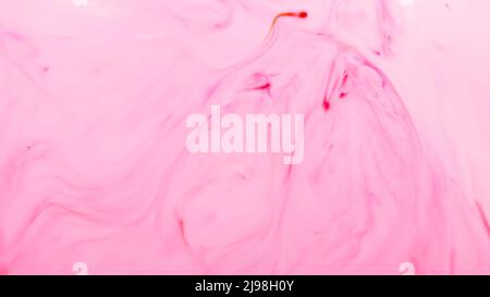 Light pink fluid art background. Blurred pink shapes on a liquid surface. Abstract wallpaper of soft pink shades Stock Photo