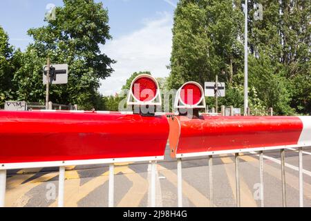 Closeup of Network Rail's Vine Road level crossing barriers, Barnes, southwest London, England, UK Stock Photo