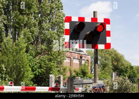 Closeup of Network Rail's Vine Road level crossing warning lights and barriers, Barnes, southwest London, England, UK Stock Photo