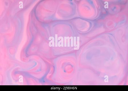 Blue pink fluid art background. Blurred multicolored shapes on a liquid surface. Abstract creative background with chaotic patterns on liquid Stock Photo