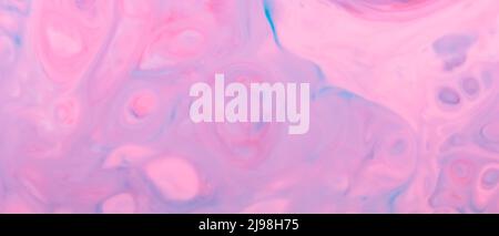 Blue pink fluid art background. Blurred multicolored shapes on a liquid surface. Abstract creative background with chaotic patterns on liquid Stock Photo