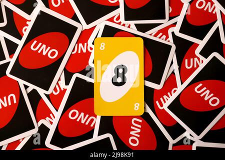 TERNOPIL, UKRAINE - MAY 15, 2022: Many colorful UNO game cards. UNO is an American shedding-type card game that is played with a specially printed dec Stock Photo