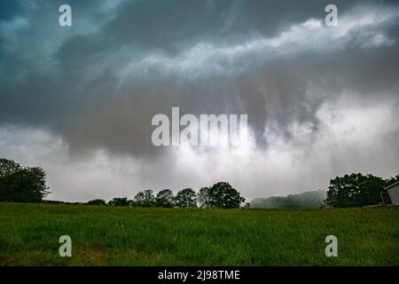Ominous sky approaching when the cold rain of a thunderstorm passes over the land like a steam roller Stock Photo