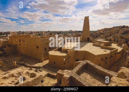 Panoramic View to the Sandstone Walls and Ancient Fortress of an Old Shali Mountain village in Siwa Oasis, Egypt Stock Photo