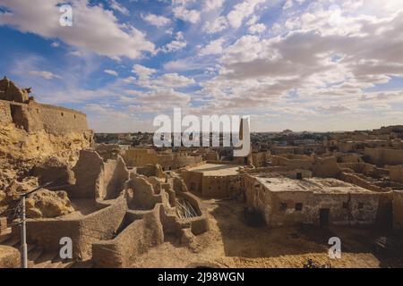 Panoramic View to the Sandstone Walls and Ancient Fortress of an Old Shali Mountain village in Siwa Oasis, Egypt Stock Photo