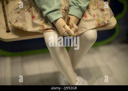 Mannequin in dress. Children's mannequin in clothing store. Plastic hands. Fashion details. Stock Photo