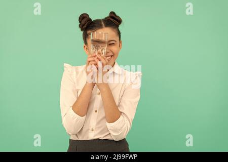 be hydrated. kid hold glass of mineral water. child feel thirsty. Stock Photo