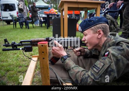 A student of a military high school tries out a machine gun at the military picnic. Recruitment for Poland's new voluntary general military service begins from May 21st as the government seeks to double the size of its armed forces. The Defense ministry has revealed details on the conditions for the year-long service, including pay rates and benefits.The introduction of voluntary basic military service was provided for by the Homeland Defense Act, which was initially proposed by the government in October but signed into law shortly after the Russian invasion of Ukraine. (Photo by Attila Husejn Stock Photo