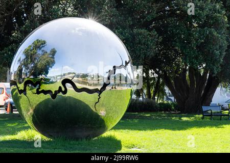 Wanganui New Zealand - April 9 2022; Bearing large silver shiny piece of public art by David McCracken in 2011 along city river side. Stock Photo