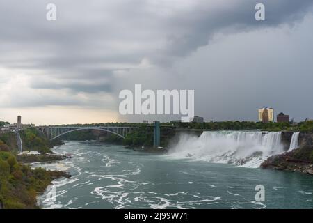 Severe weather rolling into Niagara Falls as seen from Canadian side, looking across to New York State. May 21, 2022 Credit: Puffin's Pictures/Alamy Live News Stock Photo
