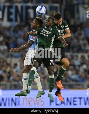 Rome, Italy. 21st May, 2022. Lazio's Jovane Cabral vies with (L) Hellas Verona's Martin Hongla (C) and Bosko Sutalo during a Serie A football match between Lazio and Hellas Verona in Rome, Italy, on May 21, 2022. Credit: Augusto Casasoli/Xinhua/Alamy Live News Stock Photo