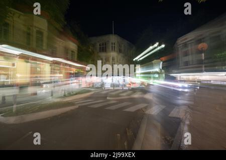 Whanganui New Zealand - April 9 2022; Night time in the city in zoom blur conveying frenetic urban pace of life and background Stock Photo