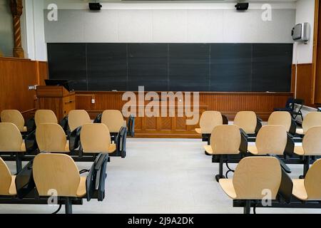 Interior of college classroom, with student desks bolted to floor Stock Photo