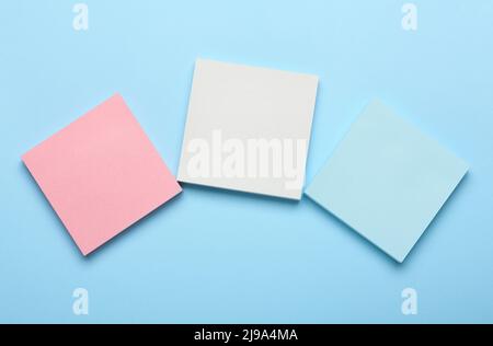 Different blank sticky notes on color background Stock Photo