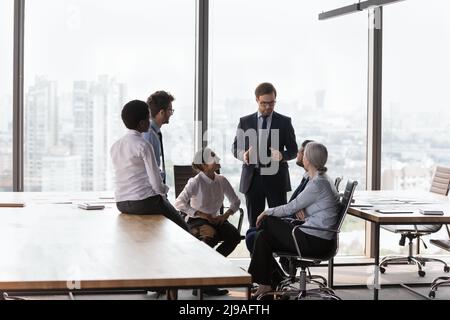 Multi ethnic team engaged in group meeting in office Stock Photo