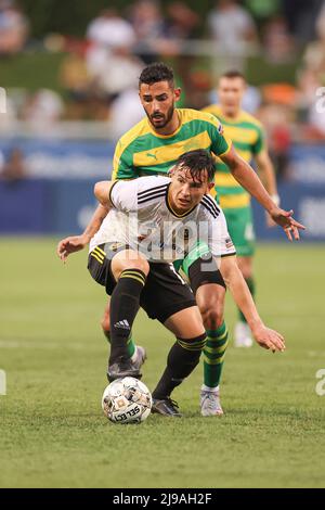 St. Petersburg, FL: Pittsburgh Riverhounds SC defender Luke Biasi (13) dribbles the ball across the pitch while pressured by Tampa Bay Rowdies midfiel Stock Photo