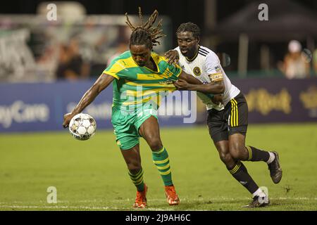 St. Petersburg, FL: Pittsburgh Riverhounds SC midfielder Kenardo Forbes (11) tries to stop Tampa Bay Rowdies forward Lucky Mkosana (77) from getting t Stock Photo