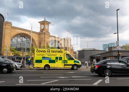 An ambulance providing Covid-19 testing is parked outside Kings Cross train station. London, UK Stock Photo