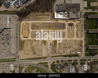 A high aerial view, directly above a large construction area in a city, during the day. Stock Photo