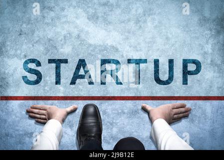 businessman ready to startup. Top view of Businessman in suit ready on the way with startup inscription. Business Challenge or do new. Get Ready to Mo Stock Photo